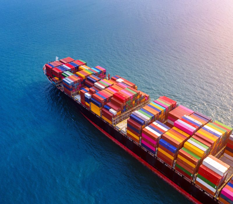 Aerial view of container cargo ship in sea.